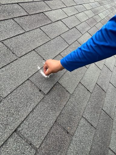 Roof shingle inspection for wind or hail utilizing chalk.