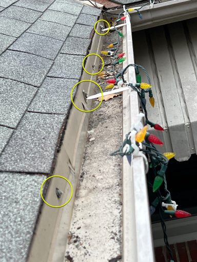 Gutter inspection with gutters incorrectly installed into drip edge. Can increase chances of water damage.